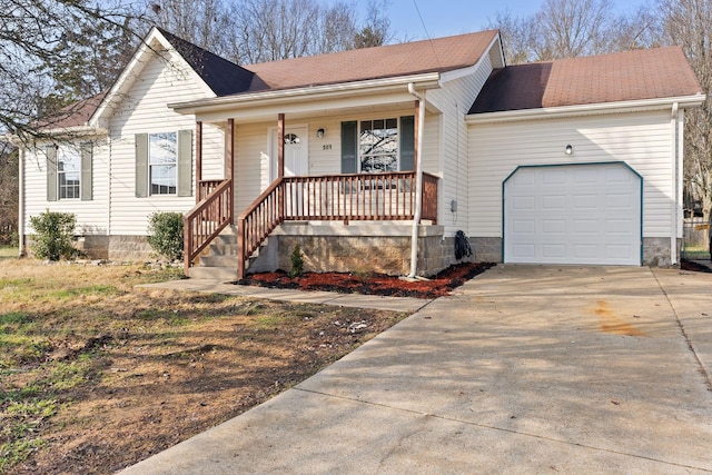 ranch-style house featuring covered porch and a garage