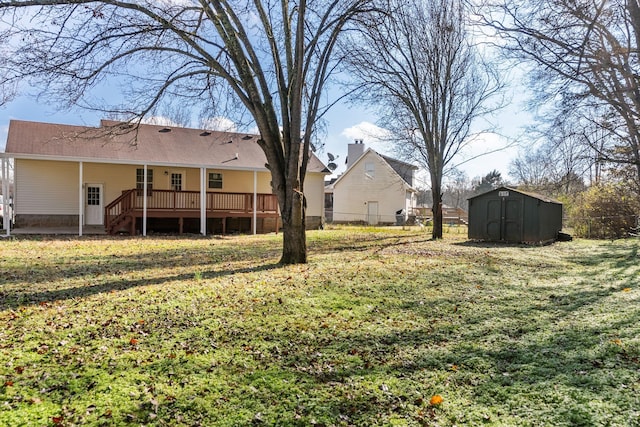 view of yard with a shed and a wooden deck