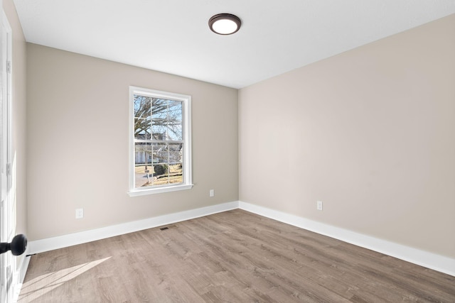 unfurnished room featuring light hardwood / wood-style flooring