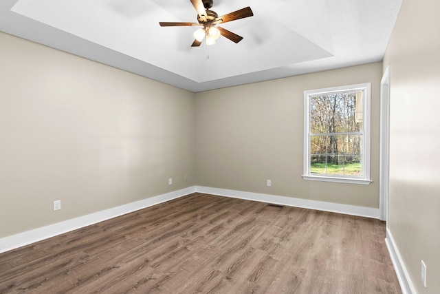 spare room with ceiling fan and light wood-type flooring