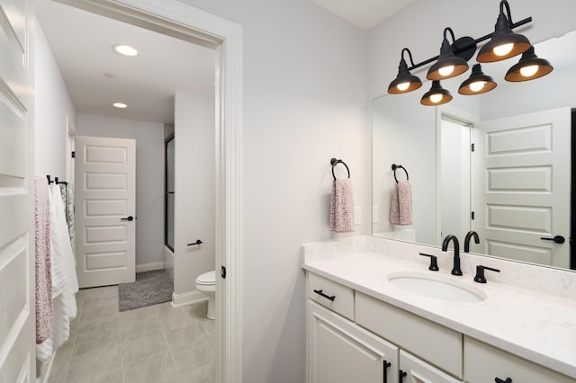 full bathroom featuring tile patterned flooring, vanity, toilet, and enclosed tub / shower combo