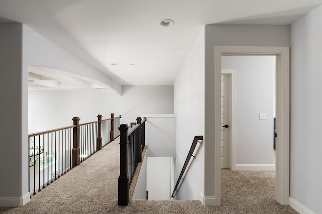 hallway with carpet floors