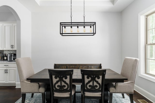 dining room with dark hardwood / wood-style floors