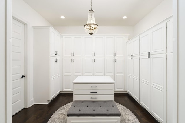 mudroom with dark hardwood / wood-style flooring and an inviting chandelier