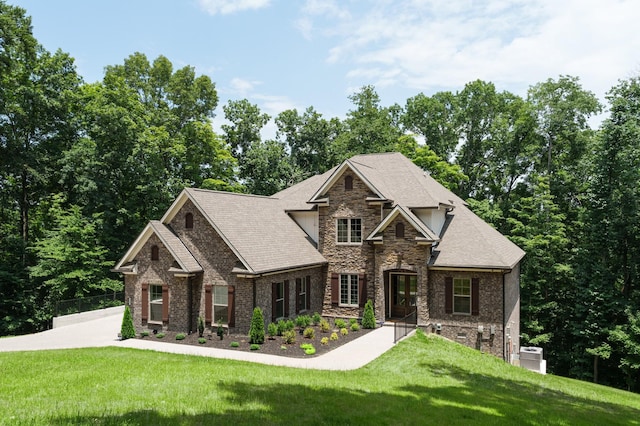 craftsman-style house with a front lawn