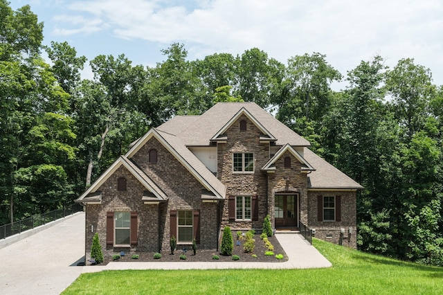 craftsman-style house with a front lawn