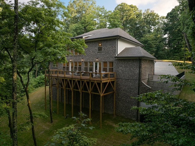 back of house featuring a deck