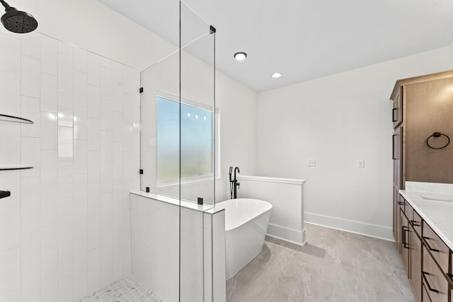 bathroom featuring vanity and separate shower and tub