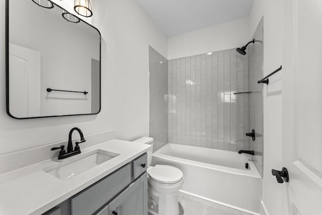 full bathroom featuring vanity, toilet, and tiled shower / bath