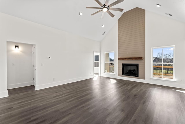 unfurnished living room with dark hardwood / wood-style floors, ceiling fan, a fireplace, and high vaulted ceiling