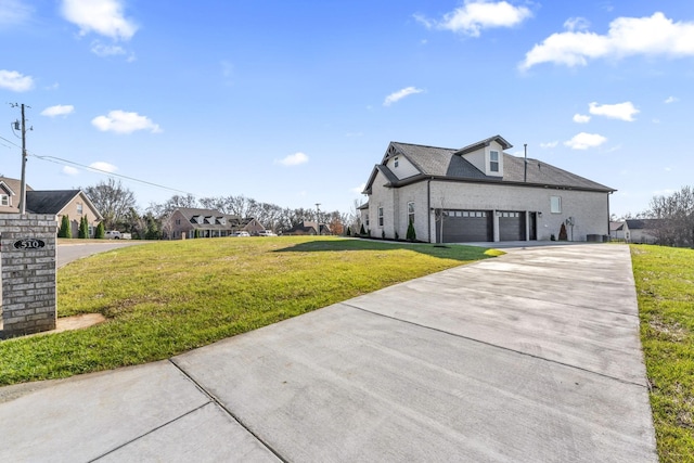 exterior space featuring a front yard and a garage