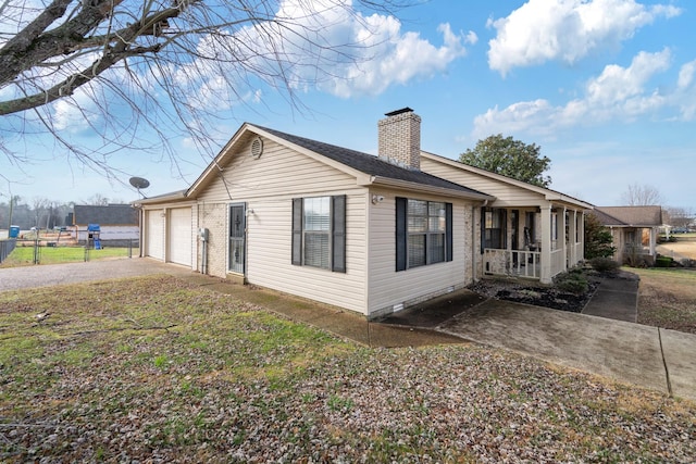 view of side of property with a garage