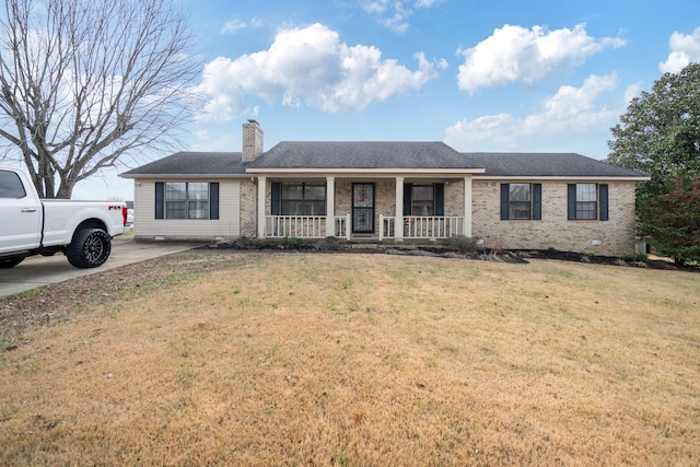 ranch-style house with covered porch and a front yard