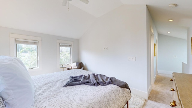 carpeted bedroom with ceiling fan and lofted ceiling