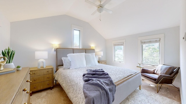 bedroom with light colored carpet, ceiling fan, and lofted ceiling