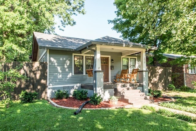 view of front of house with a porch and a front lawn