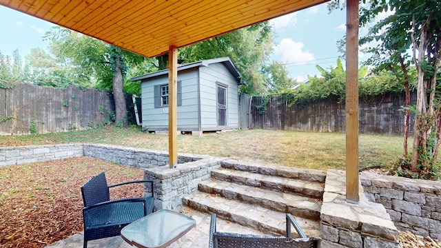 view of patio / terrace featuring a shed