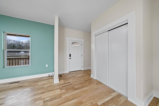 foyer entrance featuring light wood-type flooring