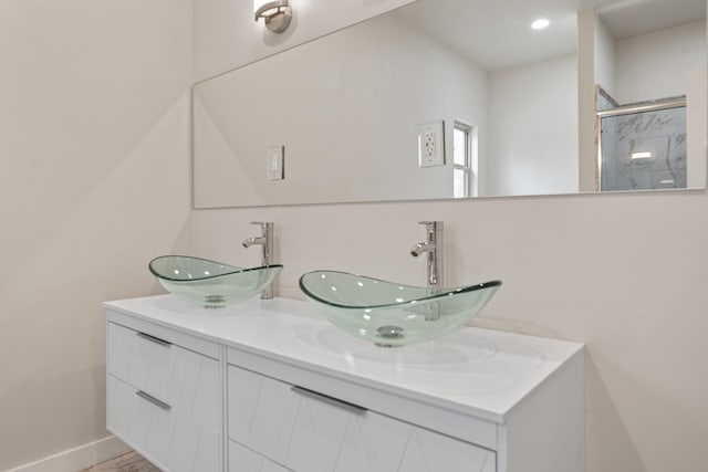 bathroom with a shower and vanity