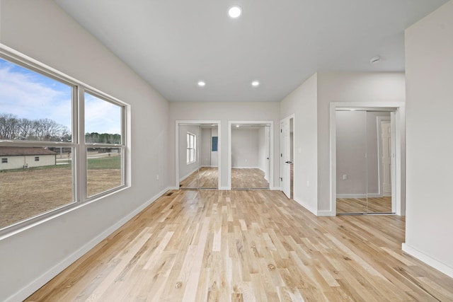 unfurnished living room with light wood-type flooring