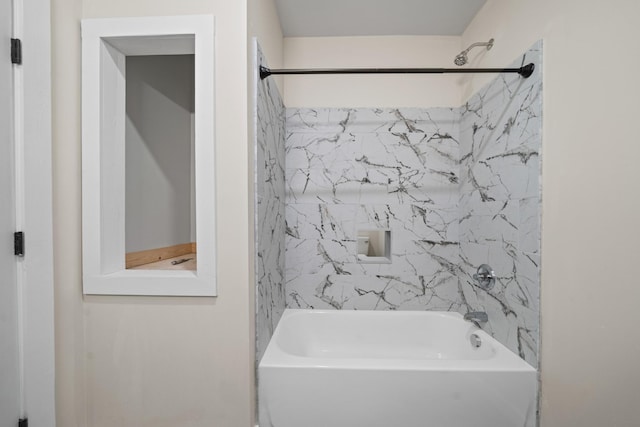 bathroom with tile walls and tub / shower combination