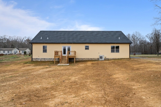 rear view of property featuring french doors