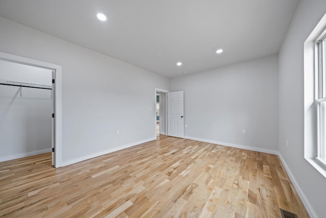 spare room with light wood-type flooring