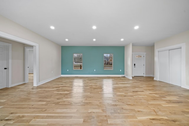 unfurnished living room featuring light hardwood / wood-style floors