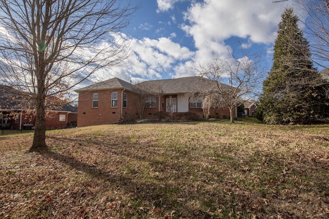 ranch-style house with a front lawn