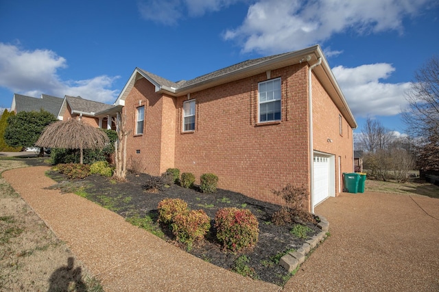 view of side of property featuring a garage