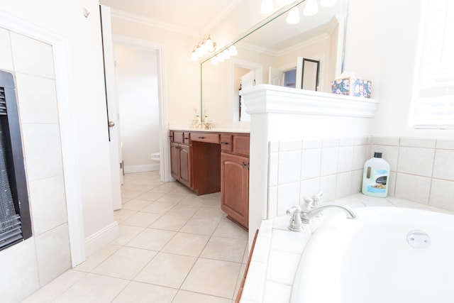 bathroom featuring tile patterned floors, a bathtub, ornamental molding, vanity, and toilet