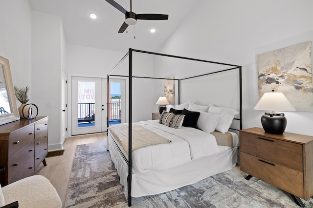 bedroom featuring access to outside, ceiling fan, high vaulted ceiling, and light hardwood / wood-style floors