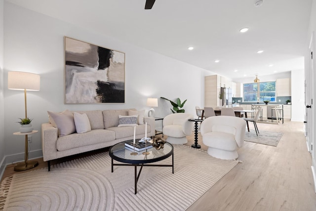 living room with light hardwood / wood-style flooring