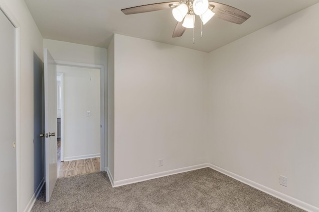 spare room with ceiling fan and carpet floors