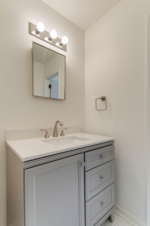 bathroom with vanity and tile patterned floors