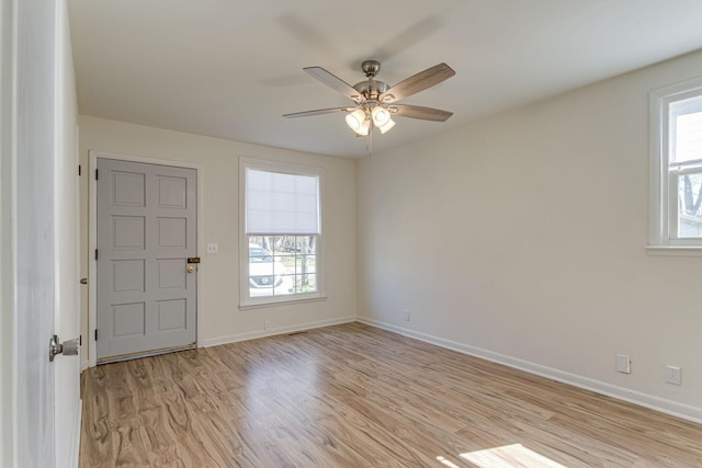 unfurnished room with light hardwood / wood-style floors and ceiling fan