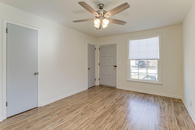 spare room with ceiling fan and light hardwood / wood-style floors