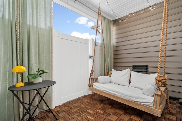 sitting room featuring dark parquet flooring