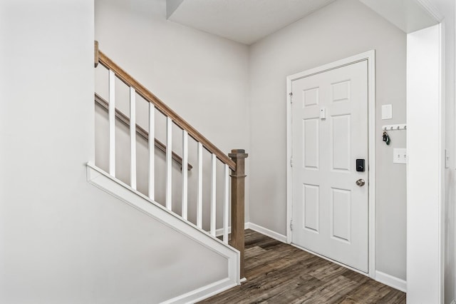 foyer with dark hardwood / wood-style floors