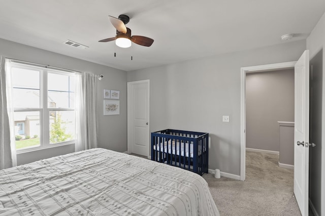 carpeted bedroom with ceiling fan