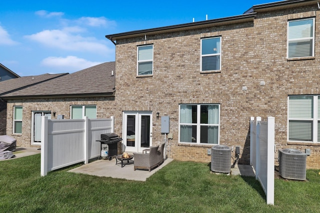 back of house with a yard, a patio, and central AC unit