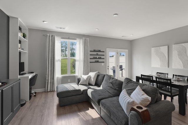 living room with light hardwood / wood-style floors