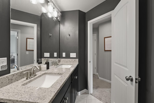 bathroom with tile patterned floors and vanity