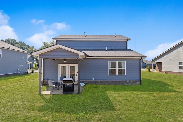 back of house featuring french doors, a patio, ceiling fan, and a lawn