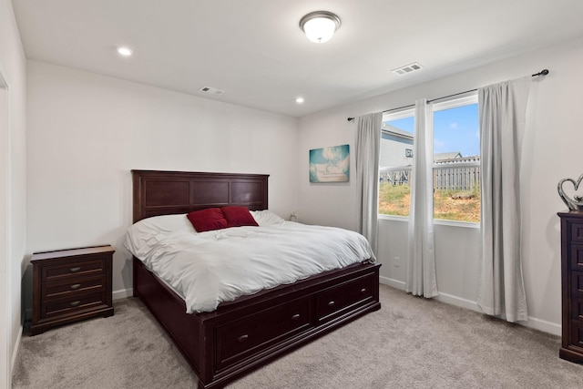 bedroom featuring light colored carpet