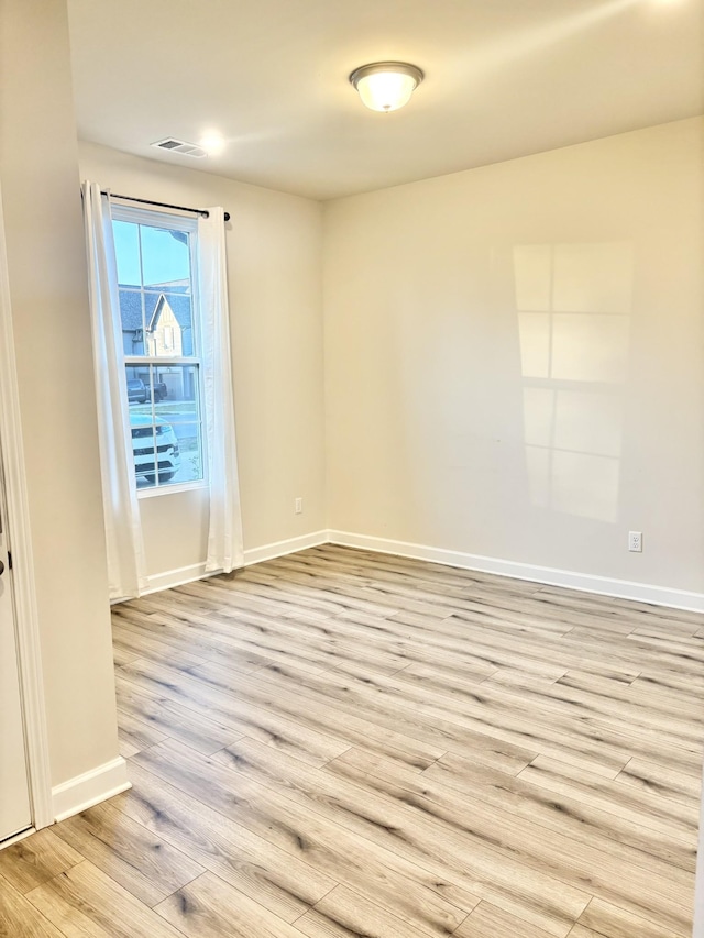 empty room with light wood-type flooring