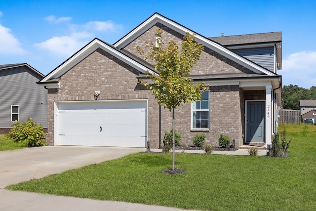 view of front of property with a garage and a front lawn