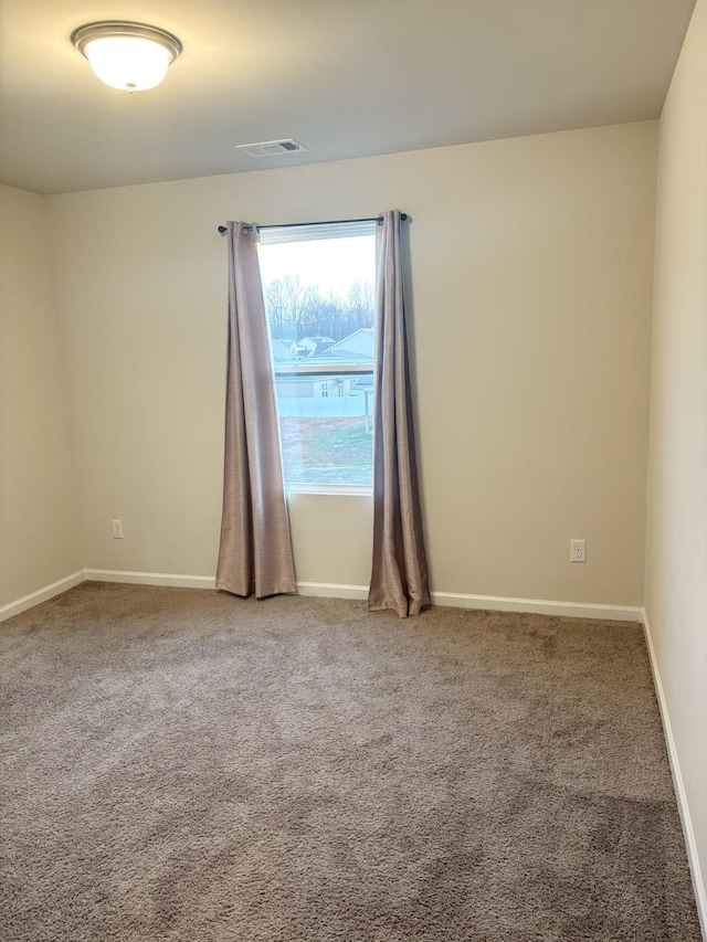 empty room with carpet flooring