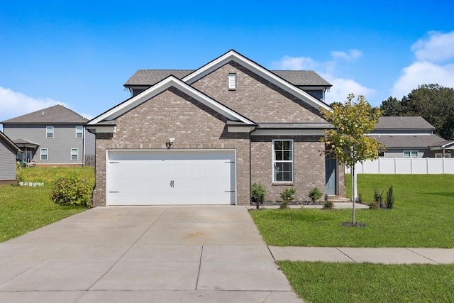 view of front of home featuring a garage and a front lawn