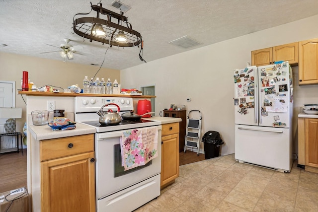 kitchen featuring a textured ceiling, ceiling fan, light brown cabinets, and white appliances